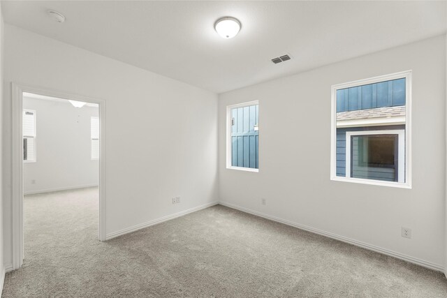 917 Janwood Dr, Plano, TX 75075 - carpeted spare room with healthy amount of natural light, baseboards, and a smoke detector