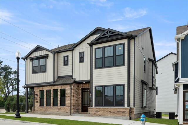 917 Janwood Dr, Plano, TX 75075 - view of front facade featuring brick siding and board and batten siding