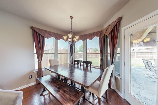 4001 Dellman Dr, Fort Worth, TX 76262 - dining area with dark wood-style flooring, baseboards, and a notable chandelier