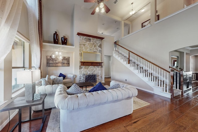 4001 Dellman Dr, Fort Worth, TX 76262 - living area with wood finished floors, a high ceiling, stairway, ceiling fan, and a fireplace