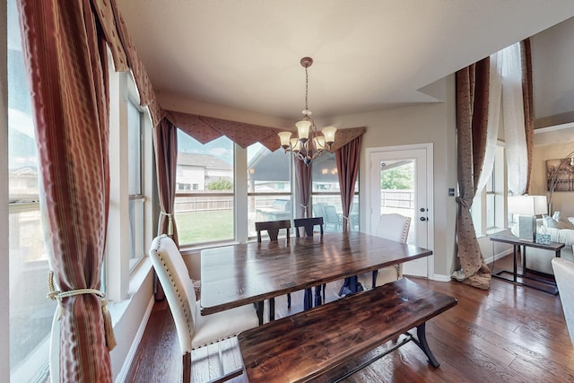 4001 Dellman Dr, Fort Worth, TX 76262 - dining space featuring a chandelier, wood finished floors, and baseboards
