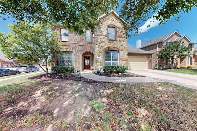 4001 Dellman Dr, Fort Worth, TX 76262 - traditional-style house featuring a garage, driveway, stone siding, and brick siding