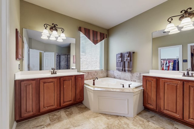 4001 Dellman Dr, Fort Worth, TX 76262 - bathroom featuring a shower stall, a garden tub, a notable chandelier, and a sink