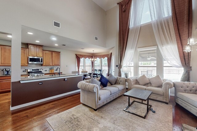 4001 Dellman Dr, Fort Worth, TX 76262 - living room with a high ceiling, visible vents, and light wood-type flooring