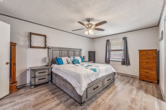 bedroom featuring crown molding, a ceiling fan, a textured ceiling, and light wood-type flooring