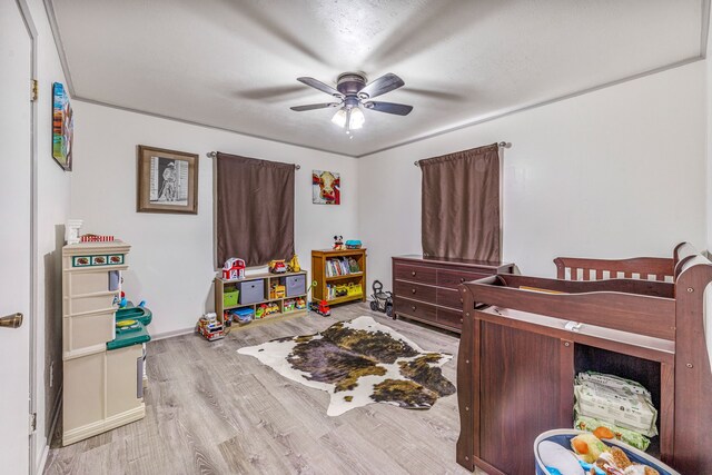 bedroom with wood finished floors and ceiling fan