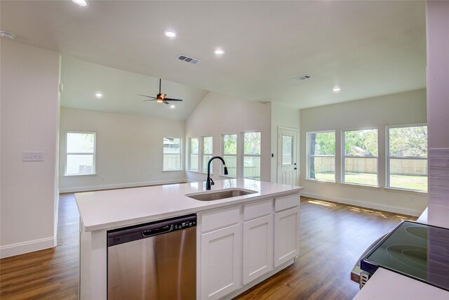 kitchen featuring stainless steel dishwasher, open floor plan, a sink, and visible vents