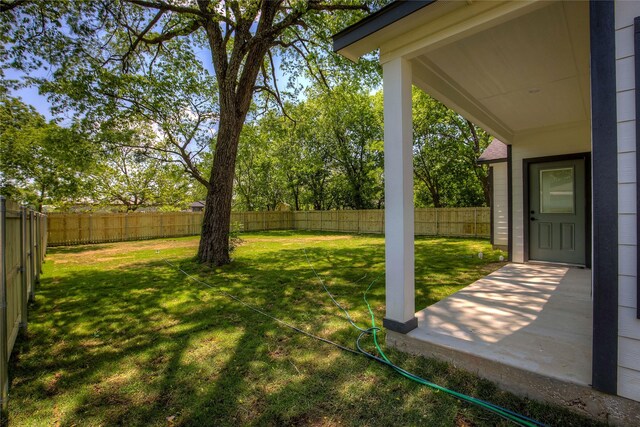 view of yard featuring a fenced backyard and a patio