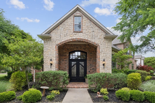 881 Saint James Ct, Fairview, TX 75069 - doorway to property with french doors, stone siding, and brick siding