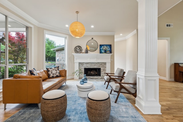 881 Saint James Ct, Fairview, TX 75069 - living area featuring ornate columns, wood finished floors, ornamental molding, a fireplace, and recessed lighting