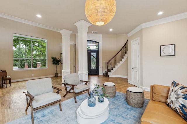 881 Saint James Ct, Fairview, TX 75069 - living room with ornate columns, light wood finished floors, healthy amount of natural light, crown molding, and recessed lighting