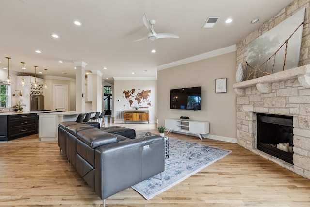 881 Saint James Ct, Fairview, TX 75069 - living area featuring a fireplace, ornamental molding, light wood-style flooring, recessed lighting, and ceiling fan
