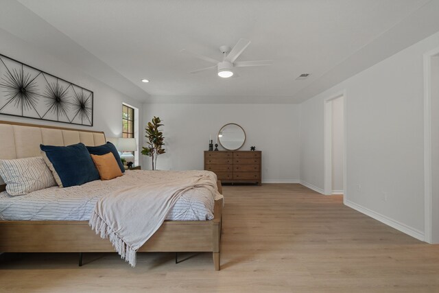 bedroom featuring recessed lighting, light wood-type flooring, baseboards, visible vents, and a ceiling fan