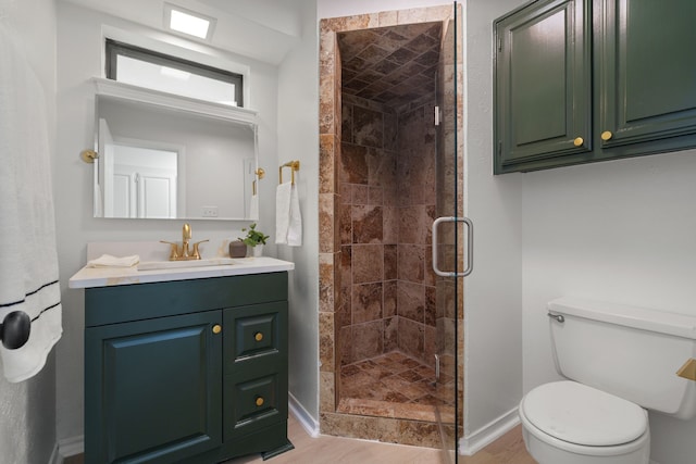 238 High Brook Dr, Richardson, TX 75080 - full bathroom with toilet, wood finished floors, a stall shower, baseboards, and vanity