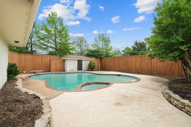 view of pool featuring a fenced backyard, a fenced in pool, and a patio area