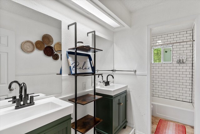 full bathroom featuring washtub / shower combination, toilet, and vanity