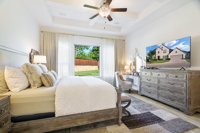 318 Waters Edge Dr, Argyle, TX 76226 - bedroom with a raised ceiling, visible vents, light wood finished floors, and a ceiling fan