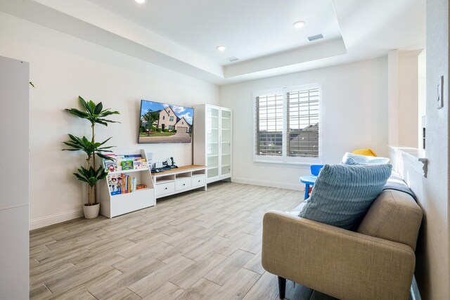 318 Waters Edge Dr, Argyle, TX 76226 - sitting room featuring light wood-style floors, a raised ceiling, baseboards, visible vents, and recessed lighting