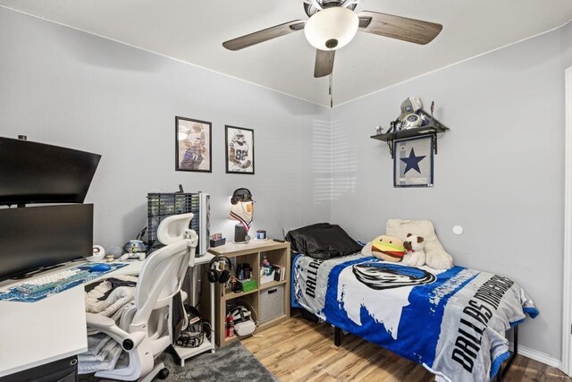 bedroom with wood finished floors and ceiling fan