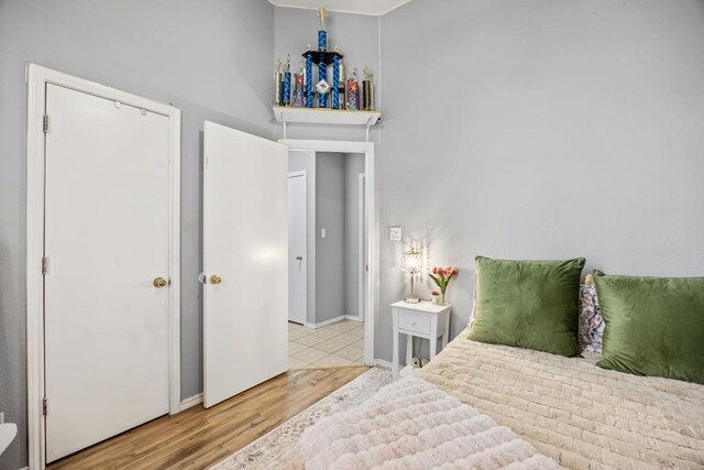bedroom featuring wood finished floors