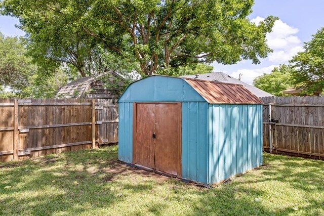 view of shed featuring a fenced backyard