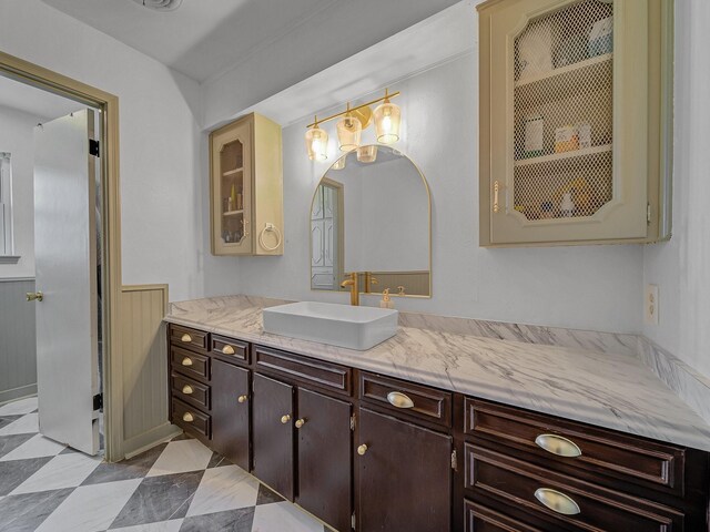 bathroom with wainscoting and vanity