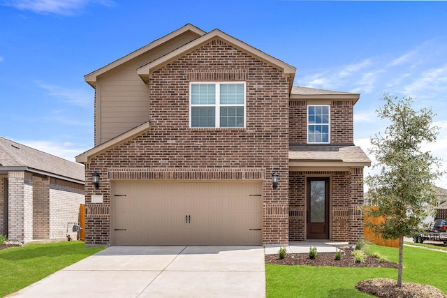 traditional home with a shingled roof, an attached garage, driveway, brick siding, and a front yard