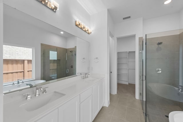 3541 Wardie Pl, Frisco, TX 75033 - bathroom featuring tile patterned flooring, visible vents, a sink, and a shower stall