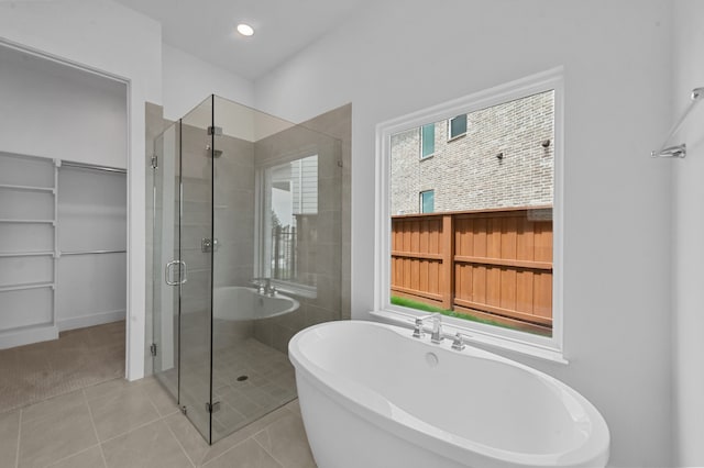 3541 Wardie Pl, Frisco, TX 75033 - full bath with recessed lighting, tile patterned floors, a walk in closet, a soaking tub, and a stall shower