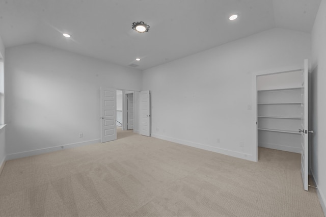 3541 Wardie Pl, Frisco, TX 75033 - unfurnished bedroom with baseboards, carpet, recessed lighting, lofted ceiling, and a walk in closet