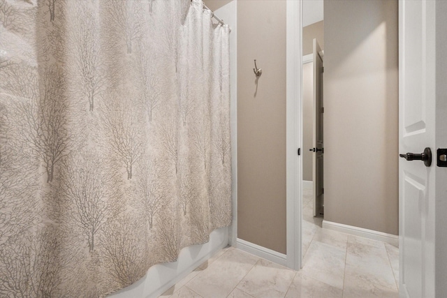 212 Rock Tree Ct, Mansfield, TX 76063 - bathroom featuring marble finish floors, baseboards, and shower / tub combo with curtain