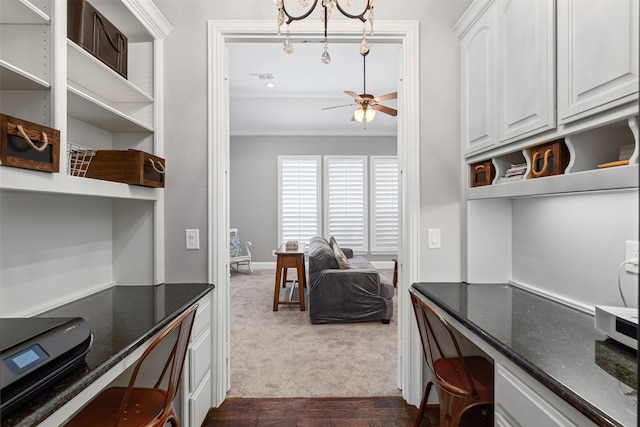 kitchen with dark stone countertops, open shelves, a ceiling fan, ornamental molding, and white cabinetry