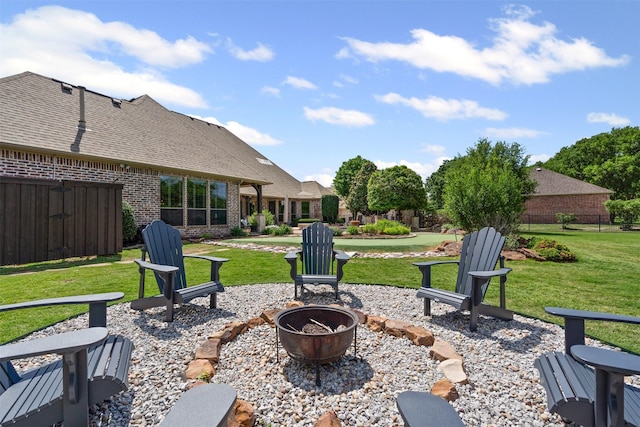 view of patio with fence and an outdoor fire pit
