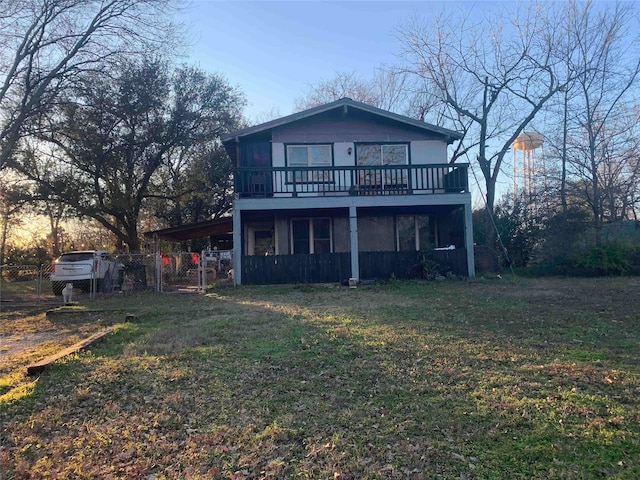 242 Club Park Ct, East Tawakoni, TX 75472 - rear view of house with fence, a carport, a yard, and a deck