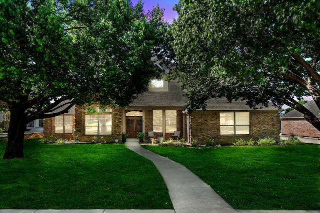 32 Royal Oaks Cir, Denton, TX 76210 - obstructed view of property with a lawn, brick siding, and a shingled roof
