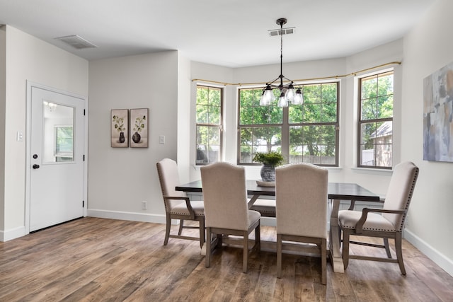 32 Royal Oaks Cir, Denton, TX 76210 - dining area with wood finished floors, healthy amount of natural light, and baseboards