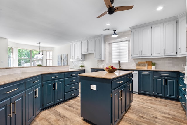 32 Royal Oaks Cir, Denton, TX 76210 - kitchen with blue cabinets, white cabinets, a ceiling fan, decorative backsplash, and recessed lighting