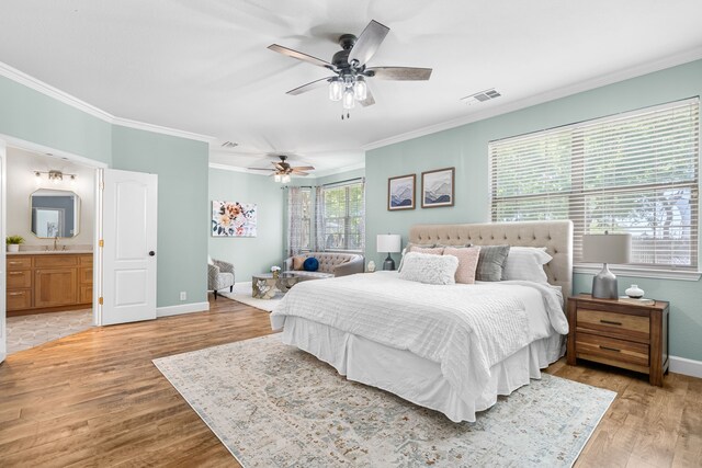 32 Royal Oaks Cir, Denton, TX 76210 - bedroom featuring ornamental molding, light wood-style floors, baseboards, ceiling fan, and connected bathroom