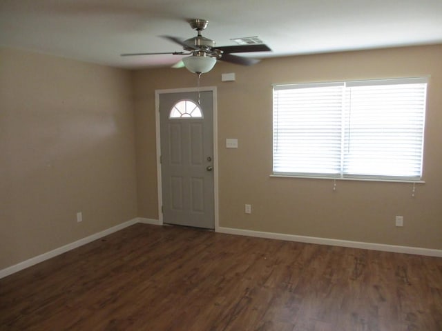 entrance foyer with wood finished floors, ceiling fan, visible vents, and baseboards