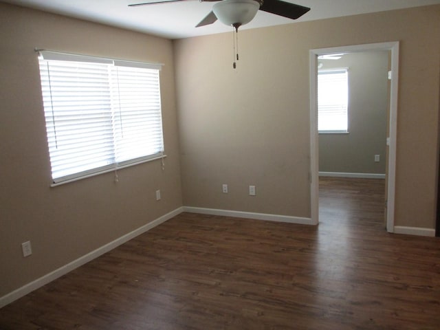 empty room featuring wood finished floors, ceiling fan, and plenty of natural light