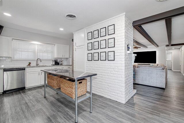 kitchen featuring dishwasher, a sink, light wood-type flooring, open floor plan, and white cabinetry