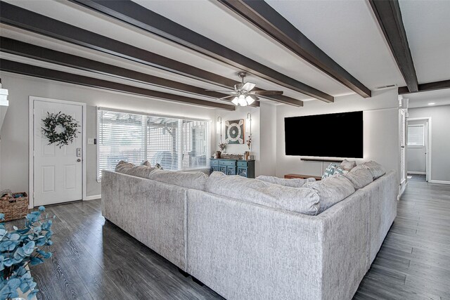 living room featuring ceiling fan, baseboards, beam ceiling, and dark wood-style floors