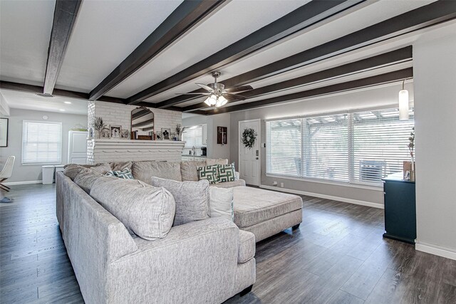 living room featuring beamed ceiling, a ceiling fan, baseboards, and dark wood-style flooring