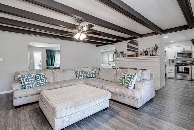 living area with dark wood-style floors, beam ceiling, baseboards, recessed lighting, and ceiling fan