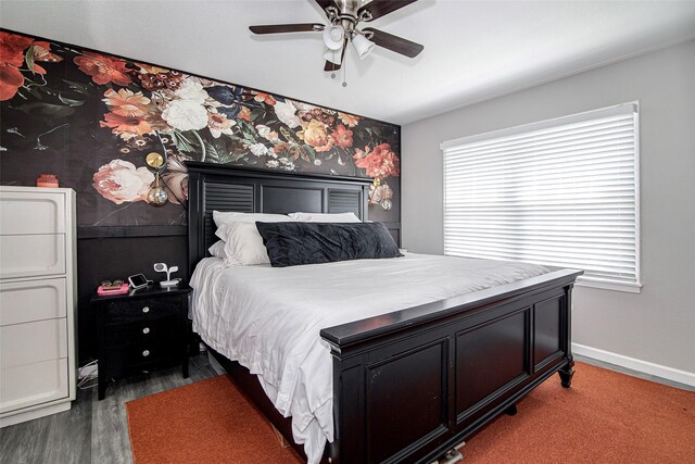 bedroom featuring dark wood-type flooring, baseboards, and ceiling fan