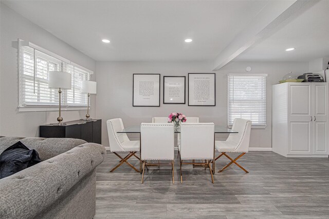 dining area featuring recessed lighting, wood finished floors, beam ceiling, and baseboards