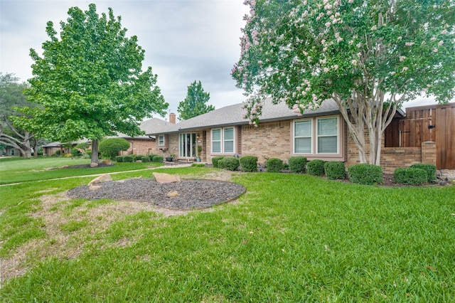 2307 Castle Rock Rd, Carrollton, TX 75007 - view of front of home featuring a chimney, brick siding, and roof with shingles