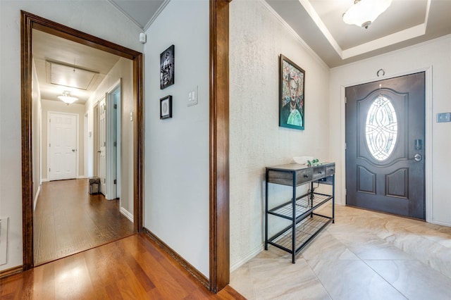 2307 Castle Rock Rd, Carrollton, TX 75007 - foyer entrance with light wood-style floors, ornamental molding, and baseboards
