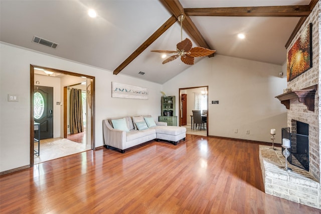 2307 Castle Rock Rd, Carrollton, TX 75007 - living room with a brick fireplace, wood finished floors, a ceiling fan, and baseboards