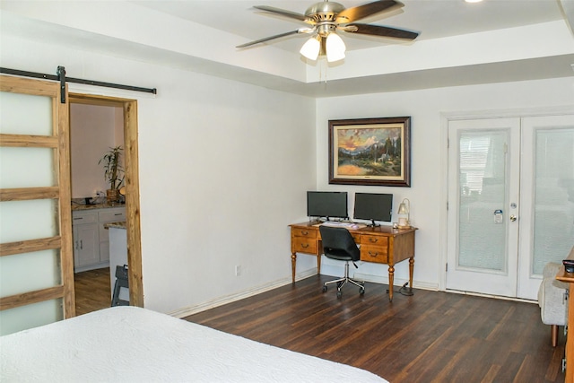 4024 Calmont Ave, Fort Worth, TX 76107 - bedroom with a barn door, baseboards, and wood finished floors